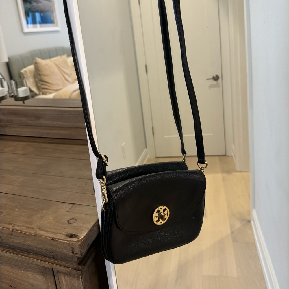 Authentic Tory Burch black cross body bag. Some scratched on metal as shown.